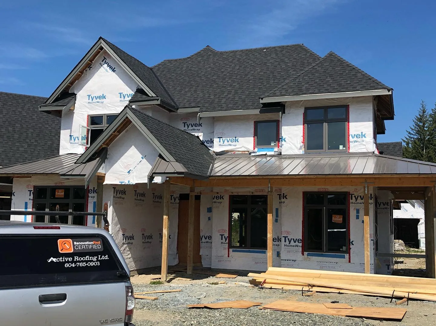 Architectural shingle and standing seam metal hybrid roof — South Surrey, BC