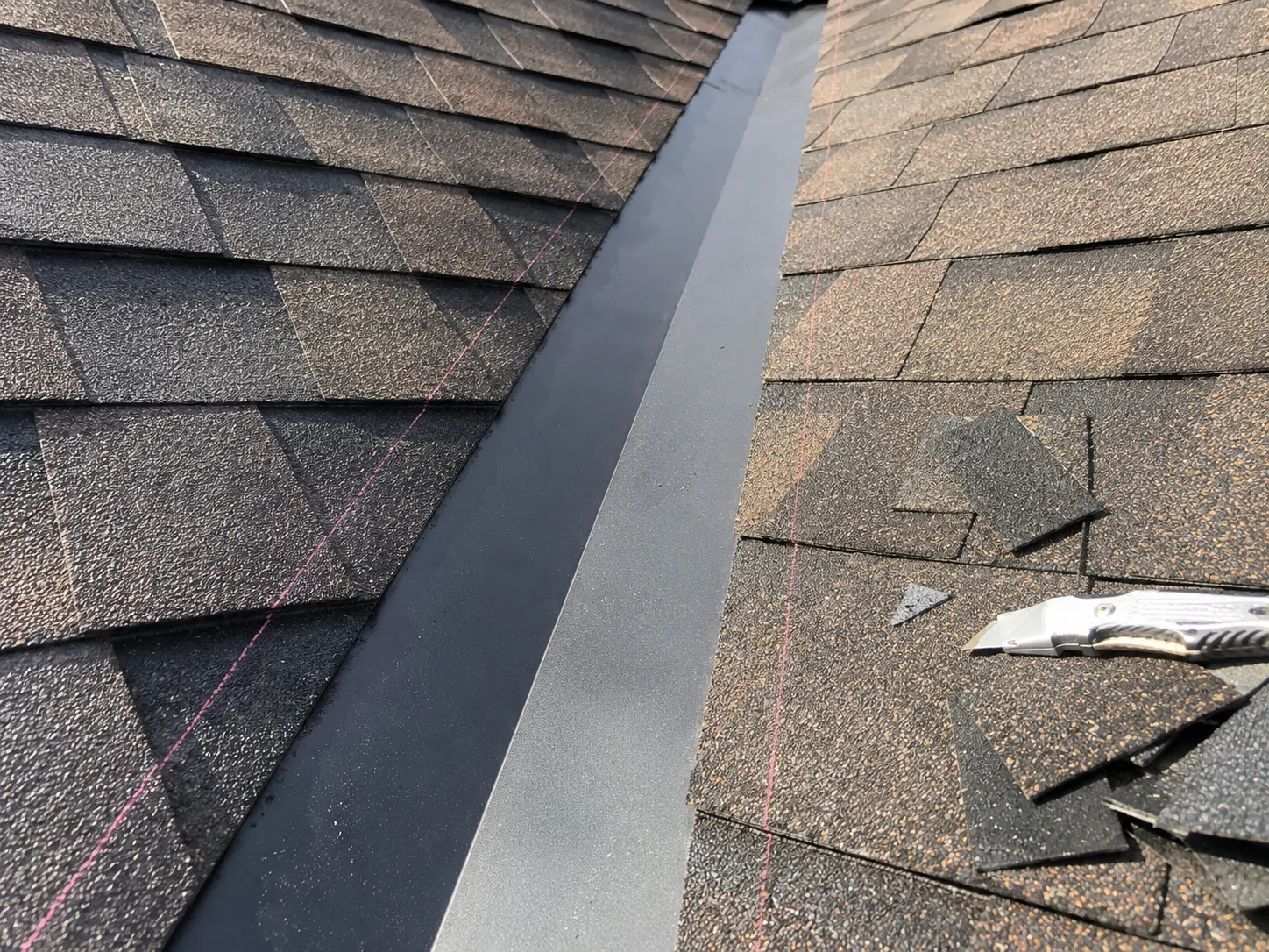 Valley flashing installation detail on an asphalt shingle roof
