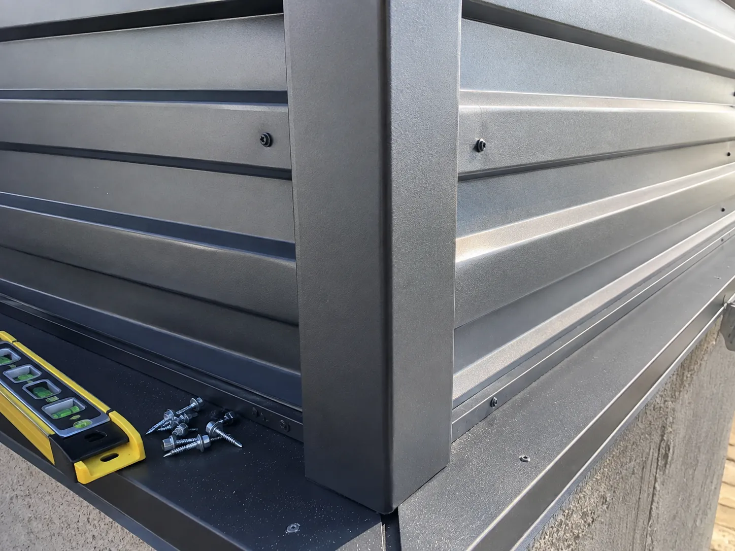 Close-up of a metal wall cladding outside corner and trim detail