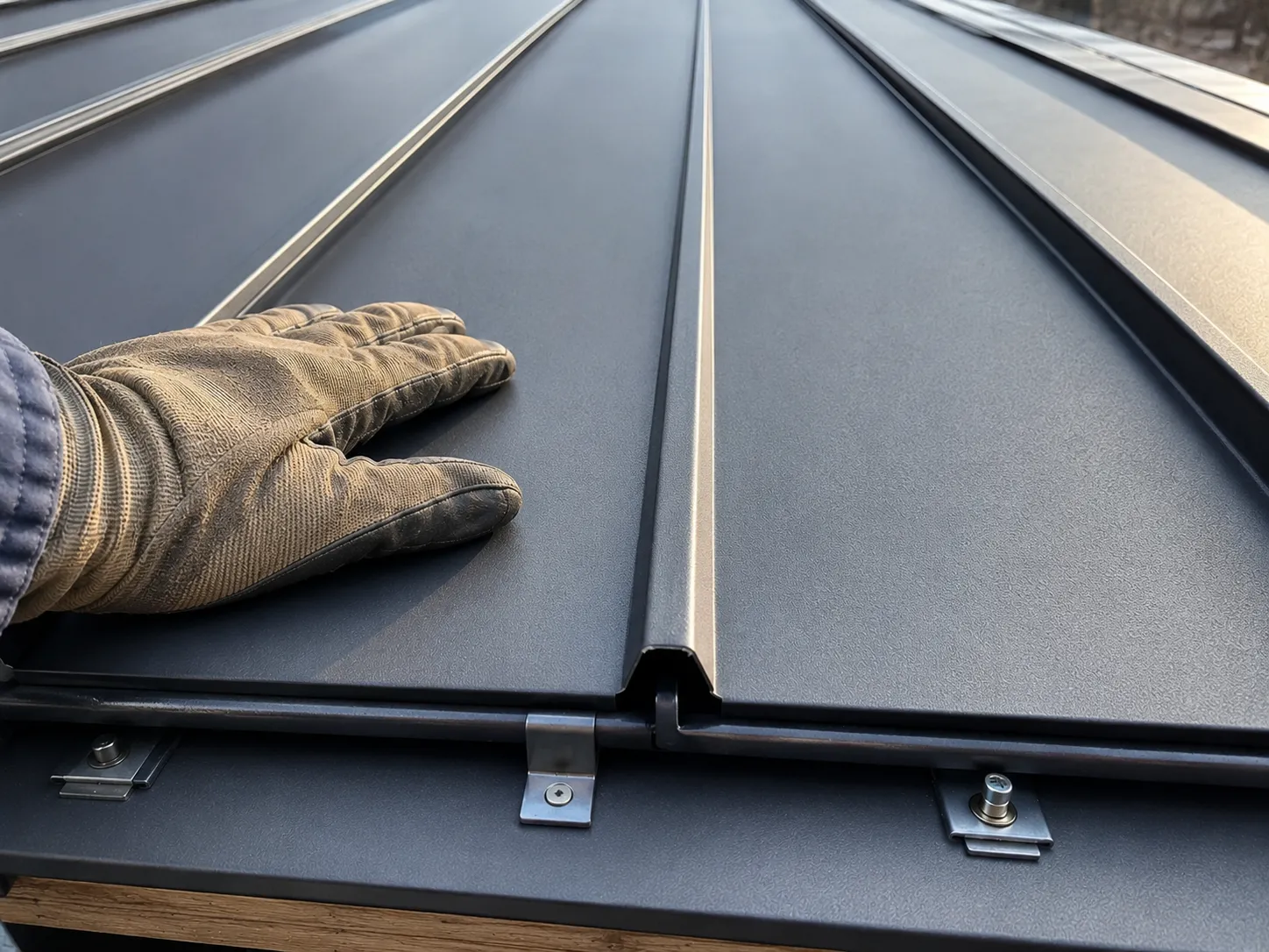 Close-up of standing seam metal roof panel ribs