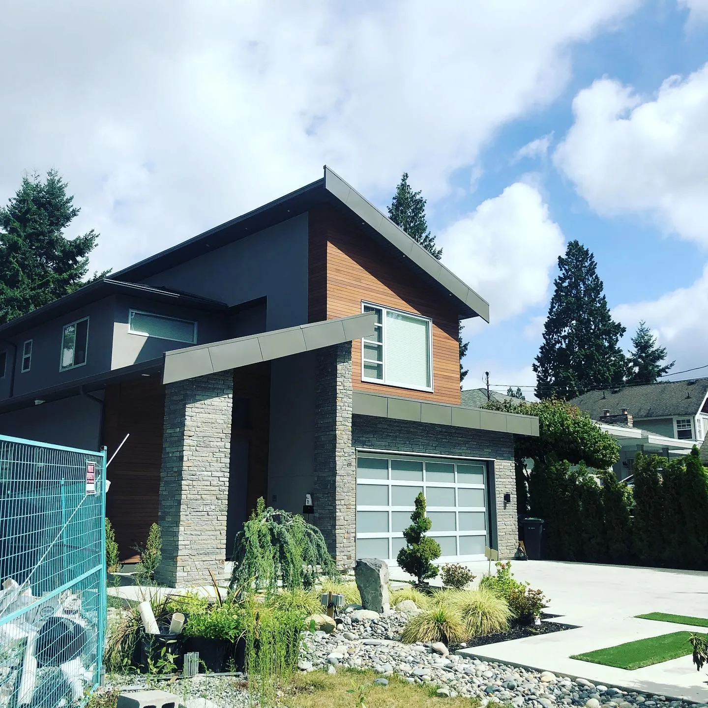 Metal fascia and trim on a mono-pitch roof exterior — Surrey, BC