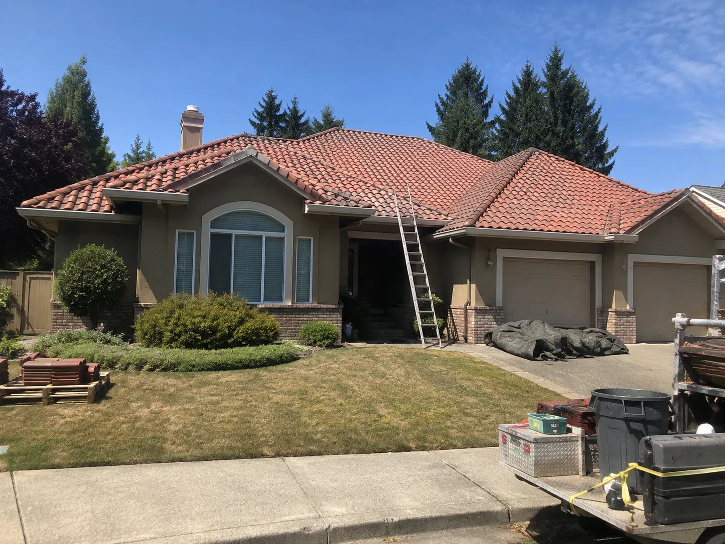 New clay tile roof completed on a suburban Surrey home