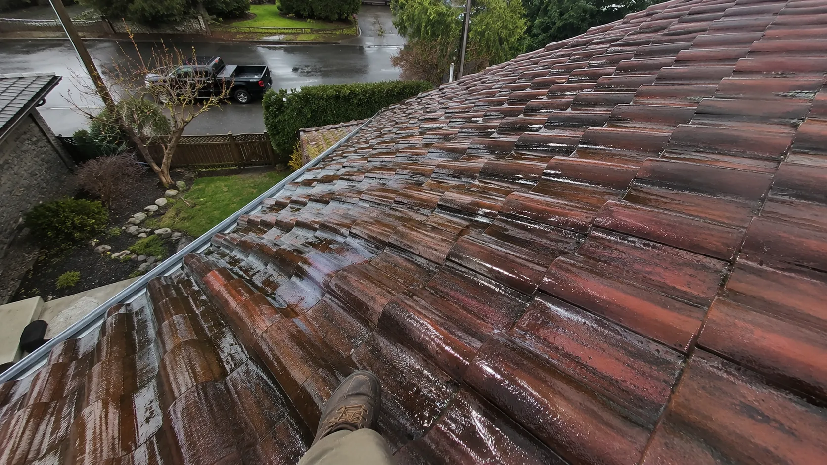 Wet tile roof shedding water after rain — inspection in Surrey, BC